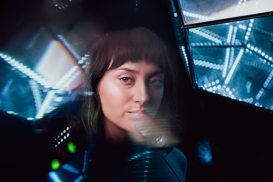A woman in a futuristic setting surrounded by LED lights, encapsulating modern elegance.