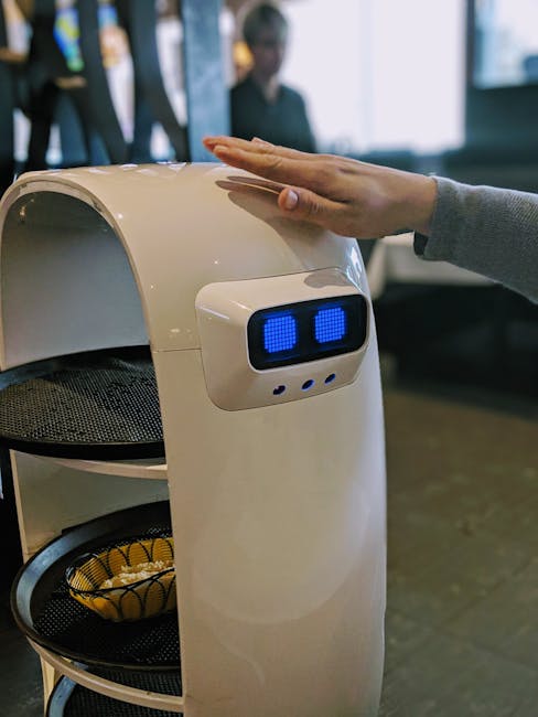 A robotic server interacting with a person in a Toronto restaurant, highlighting technology's role.
